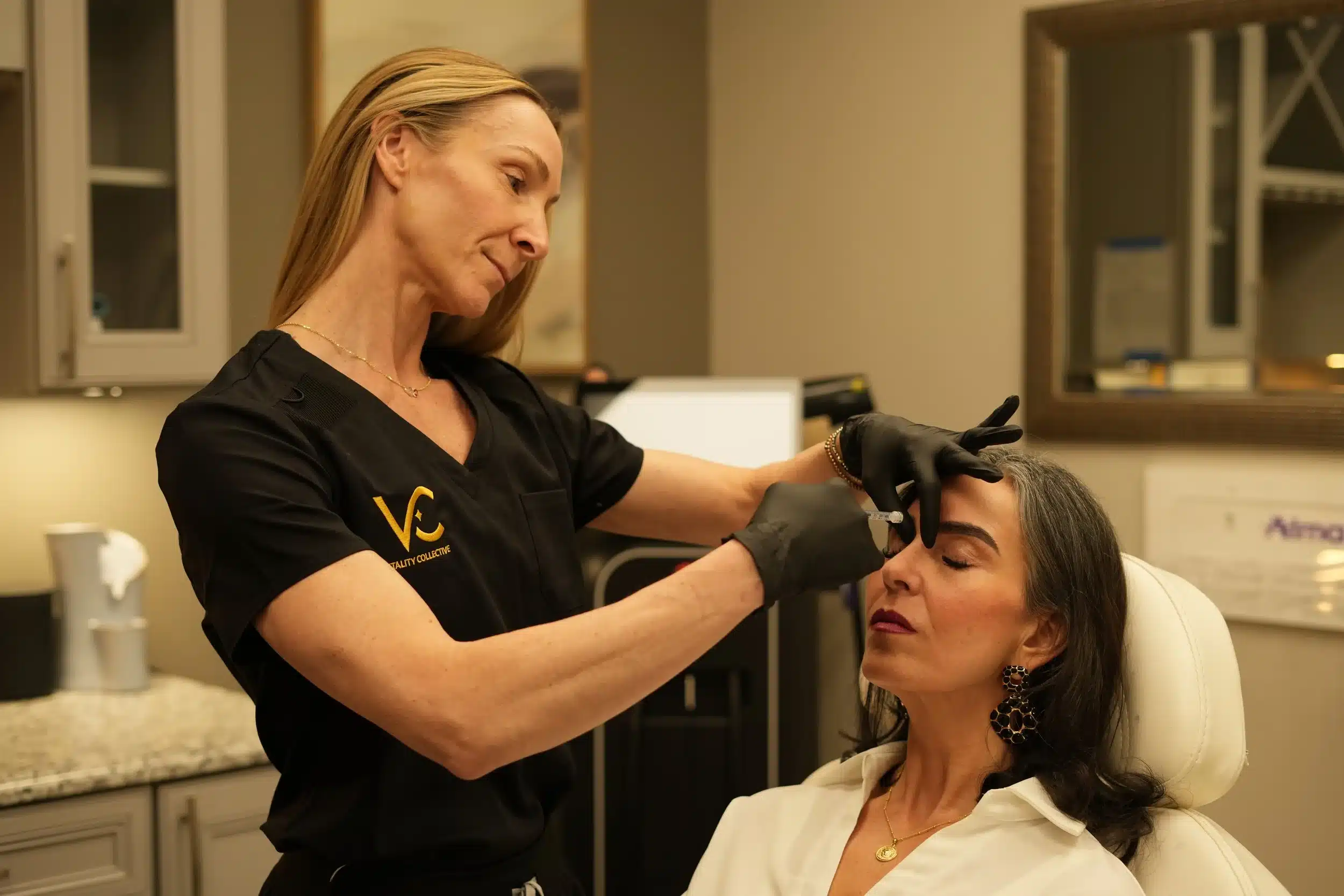Vitality Collective expert administering neurotoxin injection.