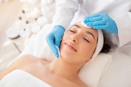 Maureen McSwiggin performing RF microneedling treatment.