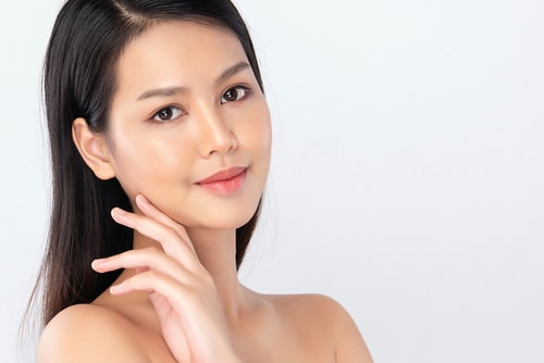Model showcasing smooth skin, related to laser treatments at Vitality Collective.