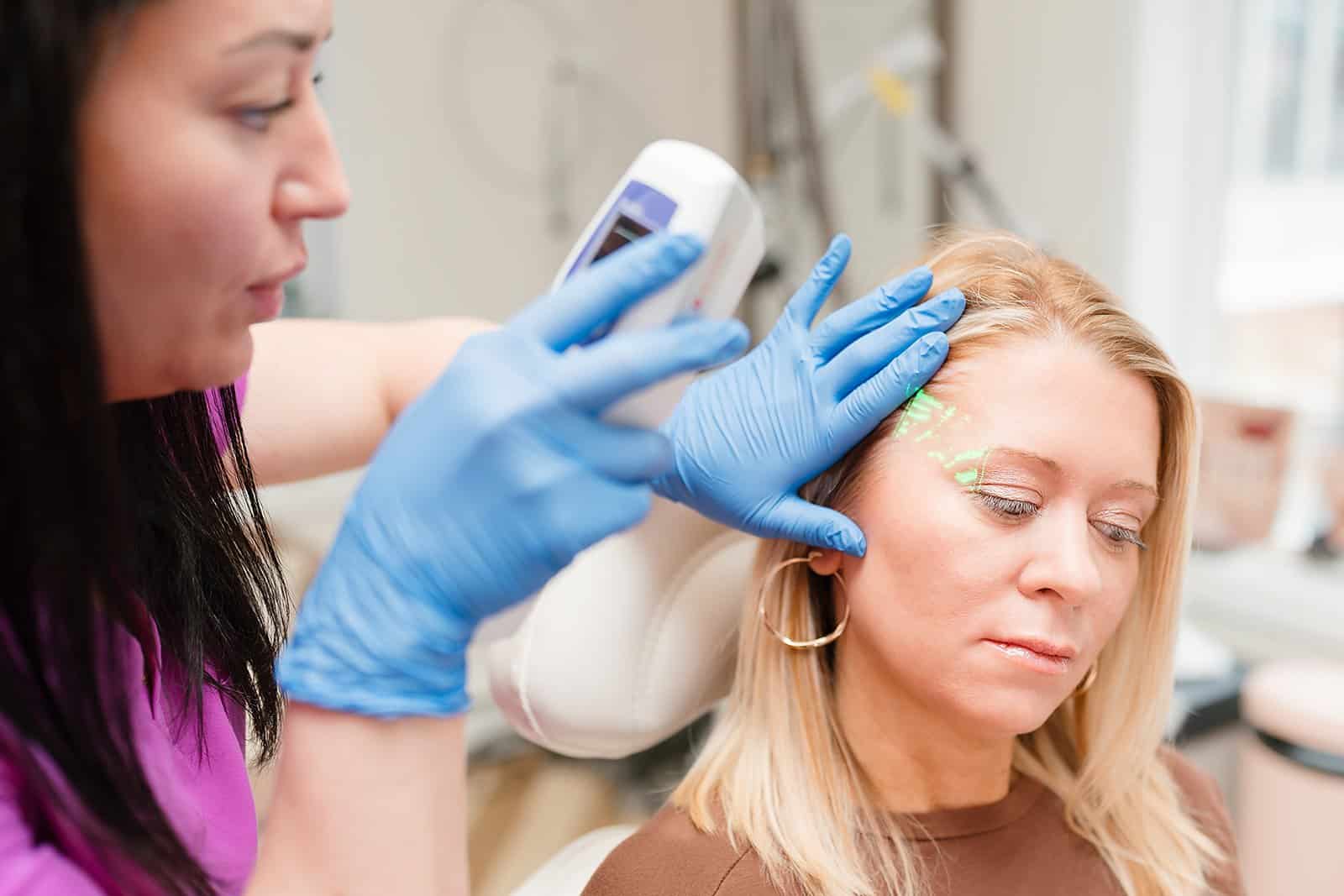 Maureen McSwiggin performing CoolPeel laser treatment at Vitality Collective.
